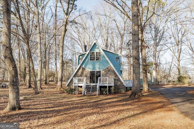 view of front of property with a wooden deck