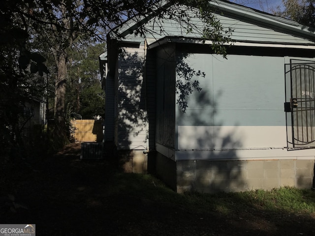 view of property exterior featuring fence