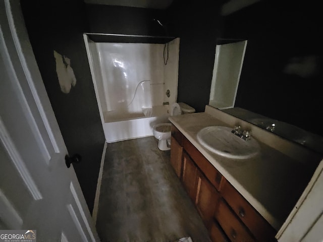 full bathroom featuring vanity, hardwood / wood-style flooring, toilet, and shower / bath combination