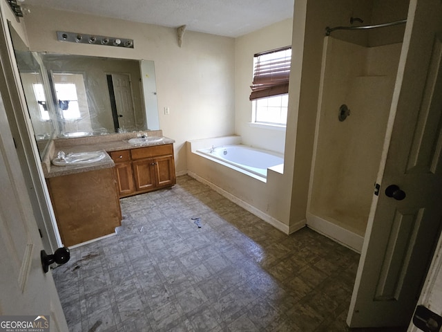 bathroom featuring independent shower and bath and vanity