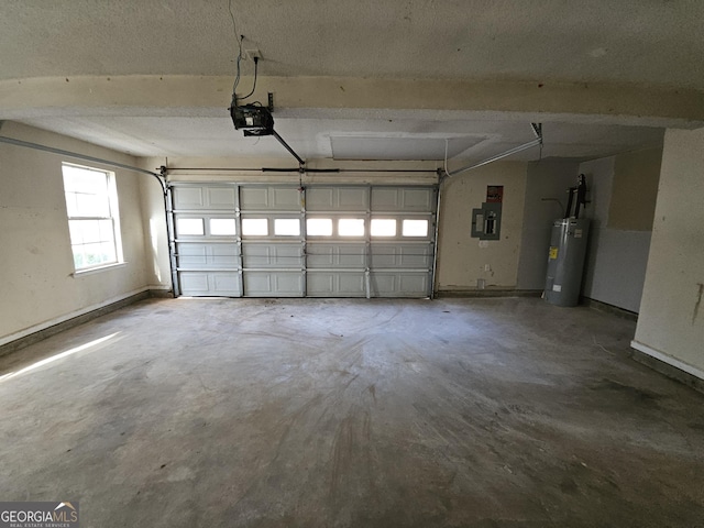 garage featuring a garage door opener, electric panel, and electric water heater