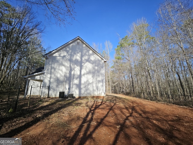 view of property exterior with central AC