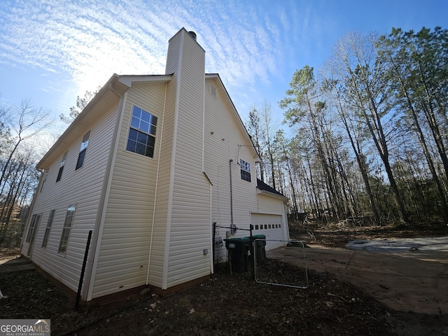 view of side of property featuring a garage