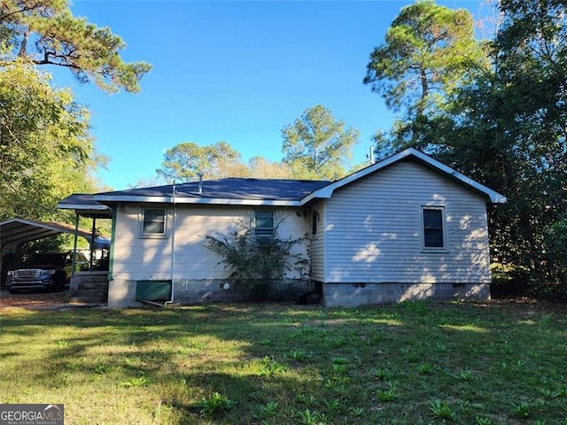 view of property exterior featuring a yard and a carport