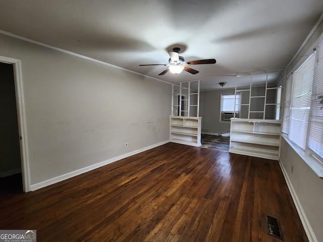 unfurnished living room featuring ceiling fan, ornamental molding, and dark hardwood / wood-style flooring