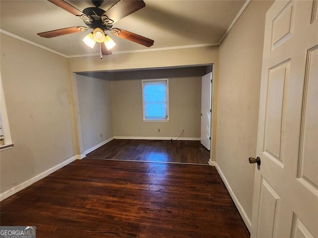 unfurnished bedroom with ornamental molding, dark wood-type flooring, and ceiling fan