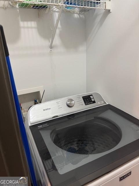 laundry room featuring washer / dryer