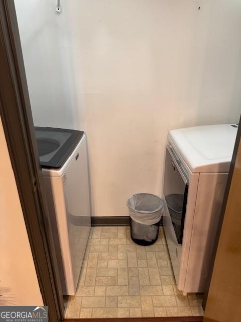 washroom featuring independent washer and dryer