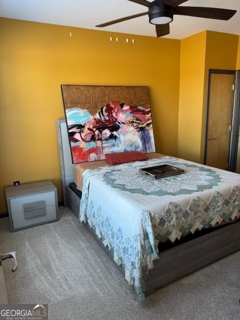 bedroom featuring ceiling fan and carpet flooring