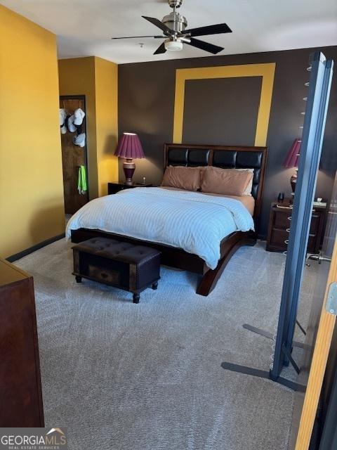 bedroom with ceiling fan and carpet flooring