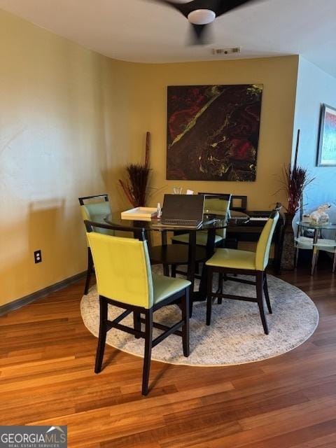 dining area with hardwood / wood-style floors