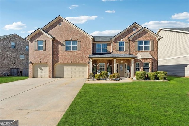 view of front of home with a garage and a front lawn