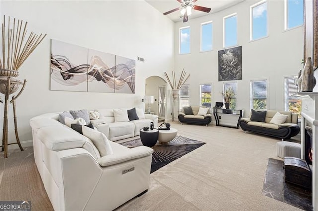 living room featuring ceiling fan and carpet flooring