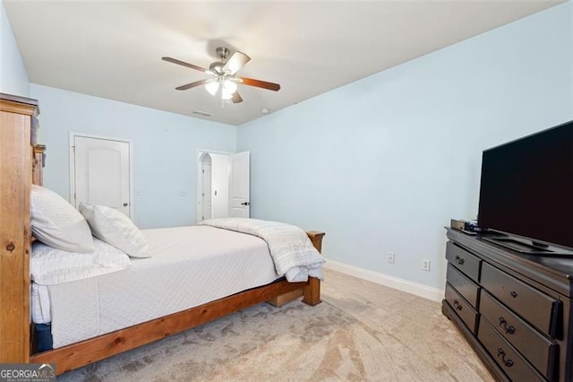 bedroom with light colored carpet and ceiling fan