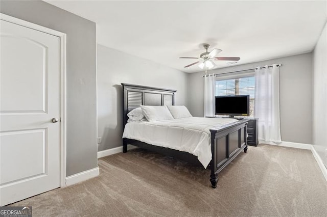 bedroom with ceiling fan and carpet flooring