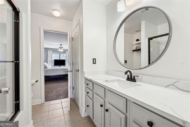 bathroom featuring tile patterned flooring and vanity