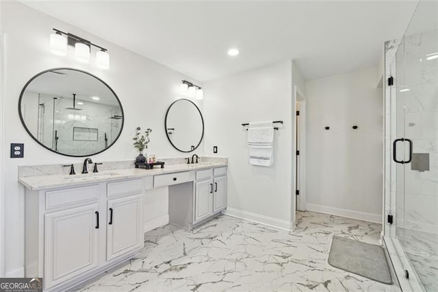 bathroom with vanity and a shower with shower door