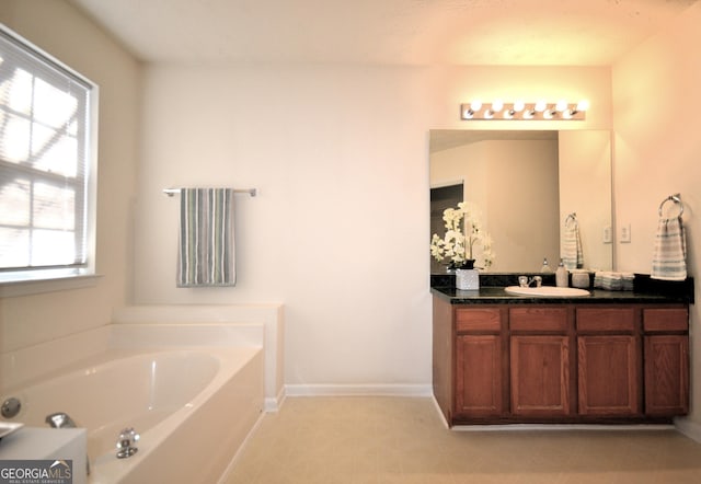 bathroom with vanity and a bathtub