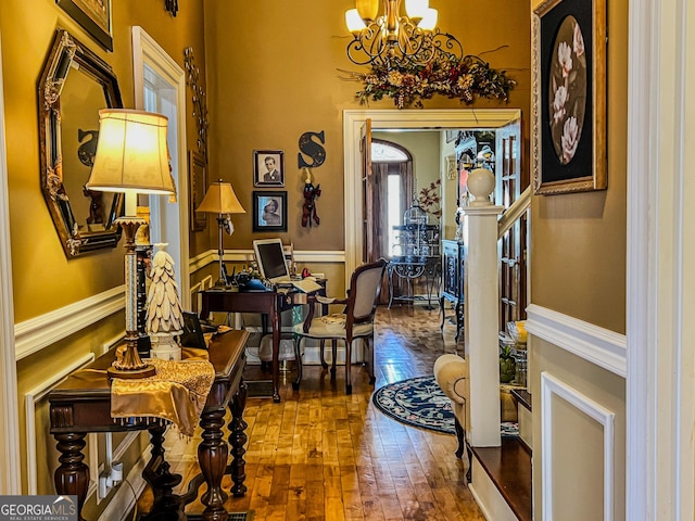 foyer entrance featuring an inviting chandelier and hardwood / wood-style floors