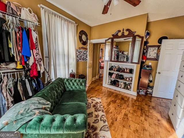 living room with hardwood / wood-style floors and ceiling fan