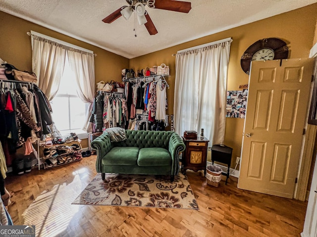 interior space with hardwood / wood-style flooring and ceiling fan