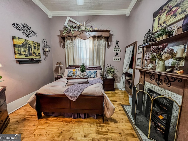 bedroom featuring ornamental molding and light wood-type flooring