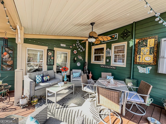 view of patio / terrace featuring an outdoor living space, ceiling fan, and a wooden deck