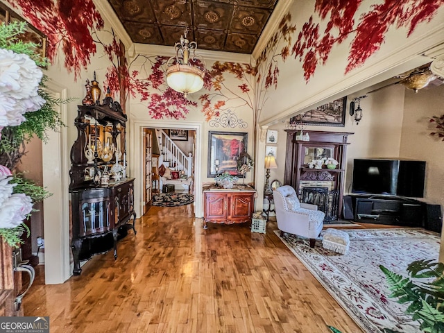 sitting room with hardwood / wood-style flooring