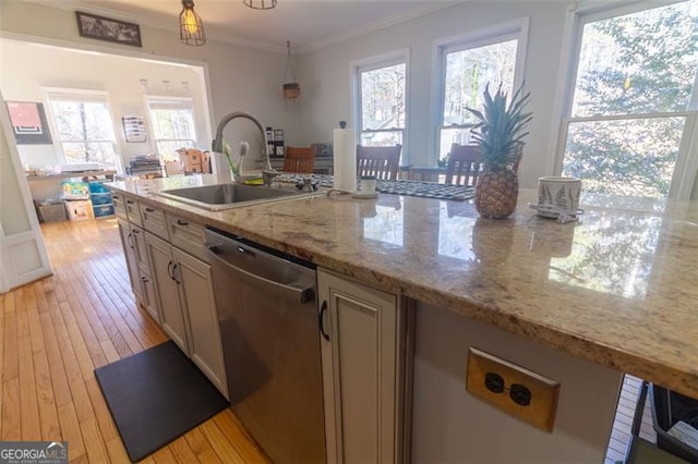 kitchen with sink, light stone counters, stainless steel dishwasher, ornamental molding, and pendant lighting