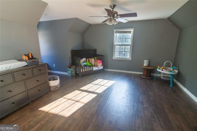 bonus room featuring dark wood-type flooring, ceiling fan, and lofted ceiling