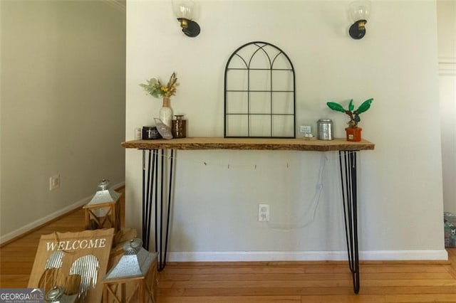 bar featuring light hardwood / wood-style flooring