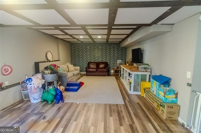 playroom with coffered ceiling and hardwood / wood-style floors