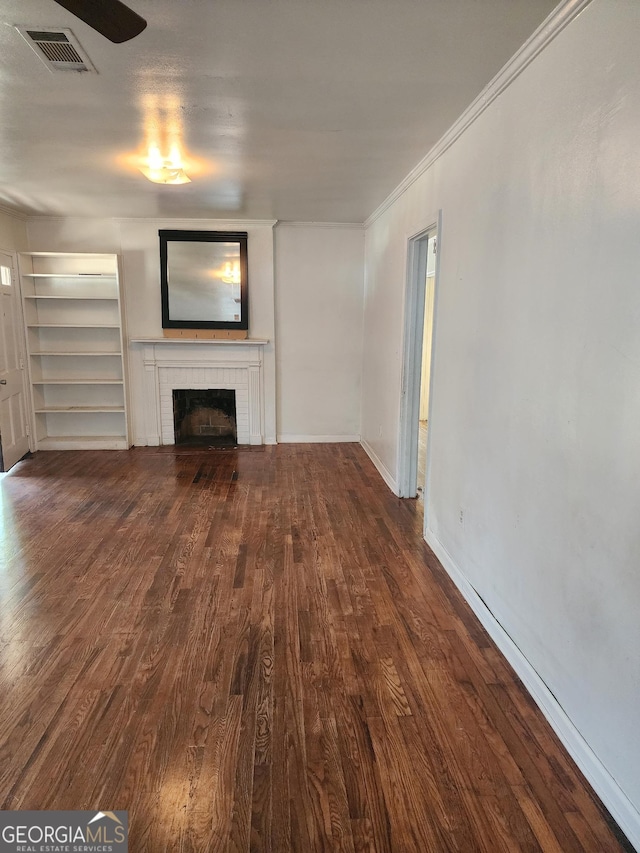 unfurnished living room with ceiling fan, ornamental molding, and dark hardwood / wood-style flooring