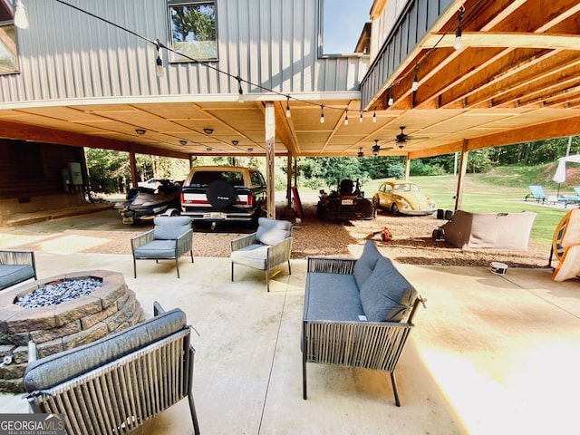 view of patio / terrace with an outdoor living space with a fire pit