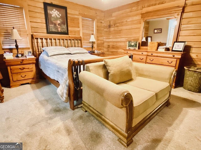 carpeted bedroom featuring wooden walls