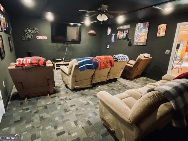 carpeted cinema with ceiling fan