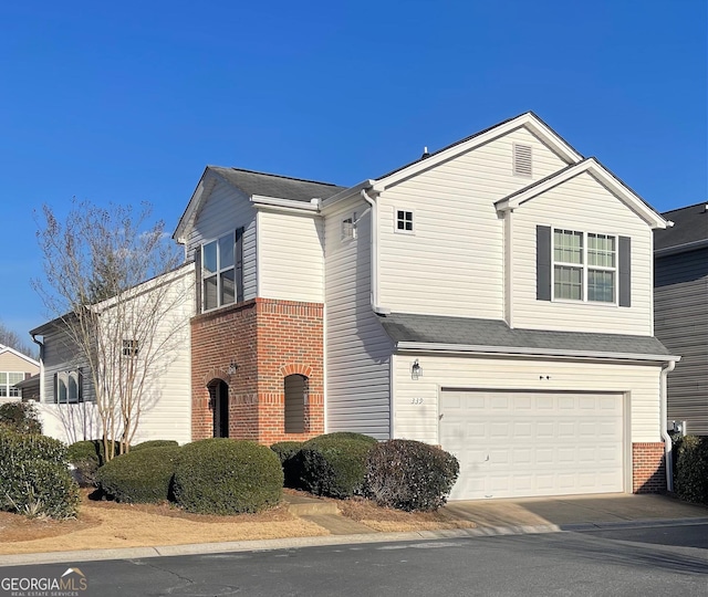 view of front of property with a garage