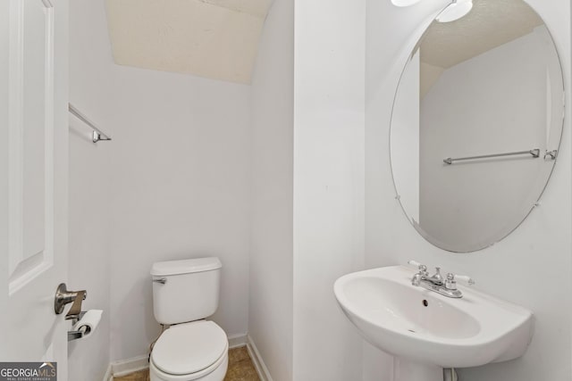 bathroom with toilet and sink