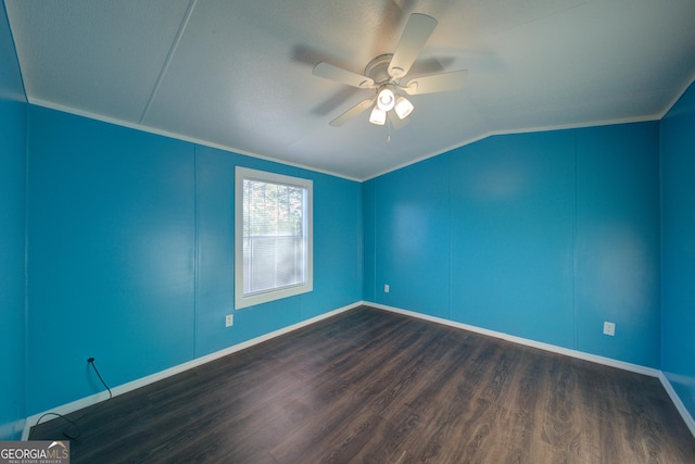 spare room featuring dark wood-type flooring, ceiling fan, and lofted ceiling