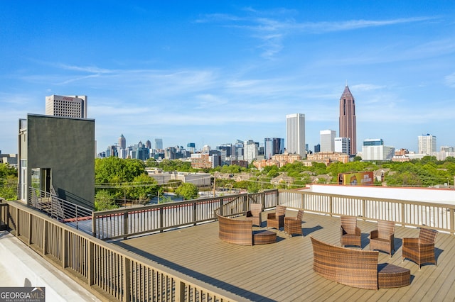 wooden deck featuring a view of city