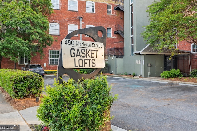 community sign with uncovered parking