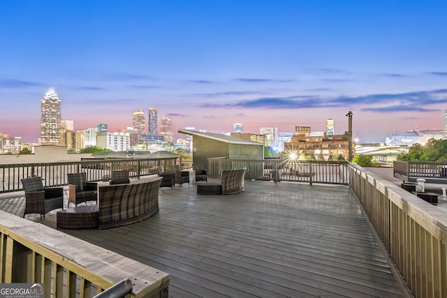 deck featuring a view of city and outdoor lounge area