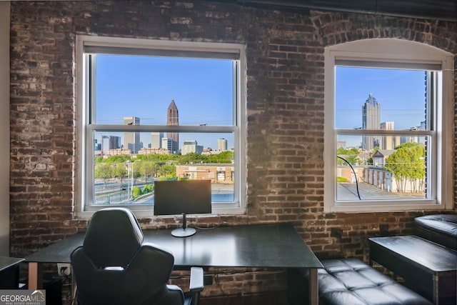 office area with brick wall