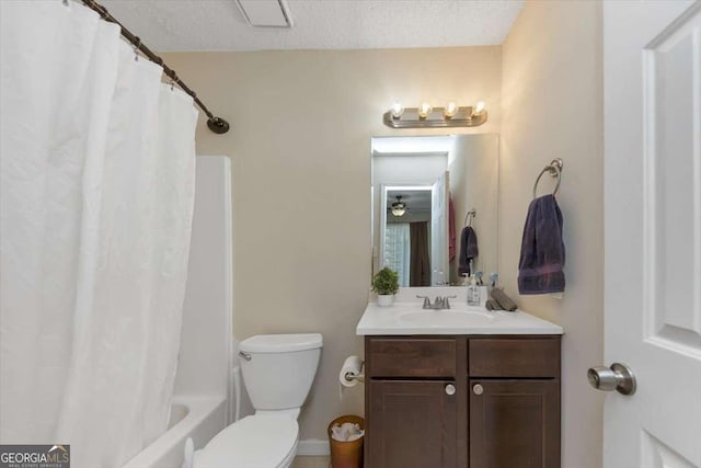 full bathroom featuring vanity, shower / tub combo, a textured ceiling, and toilet