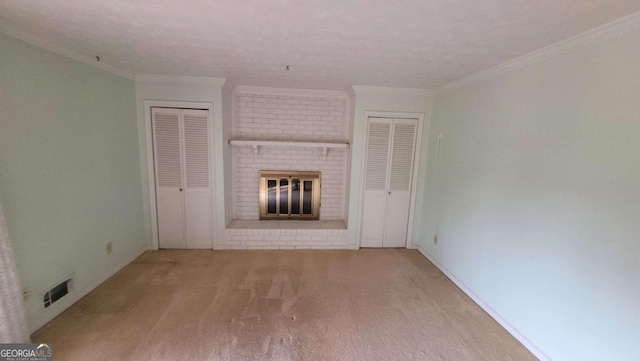 unfurnished living room with crown molding, light colored carpet, and a fireplace