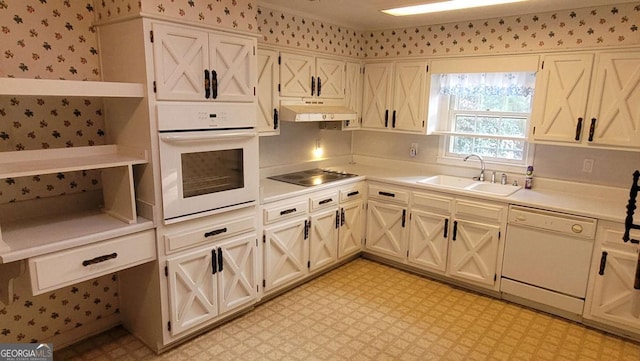 kitchen featuring white appliances and sink