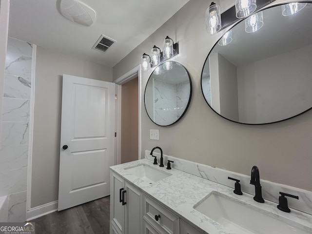 bathroom featuring vanity and hardwood / wood-style floors