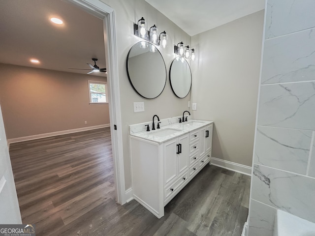 bathroom featuring vanity, hardwood / wood-style flooring, and ceiling fan