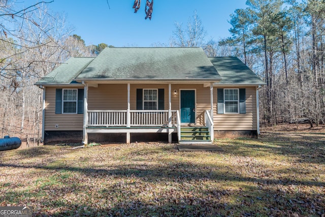 view of front of home featuring covered porch and a front lawn