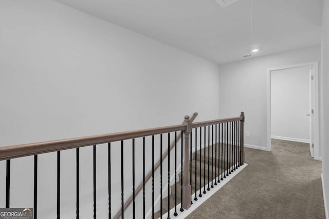 hallway featuring carpet flooring